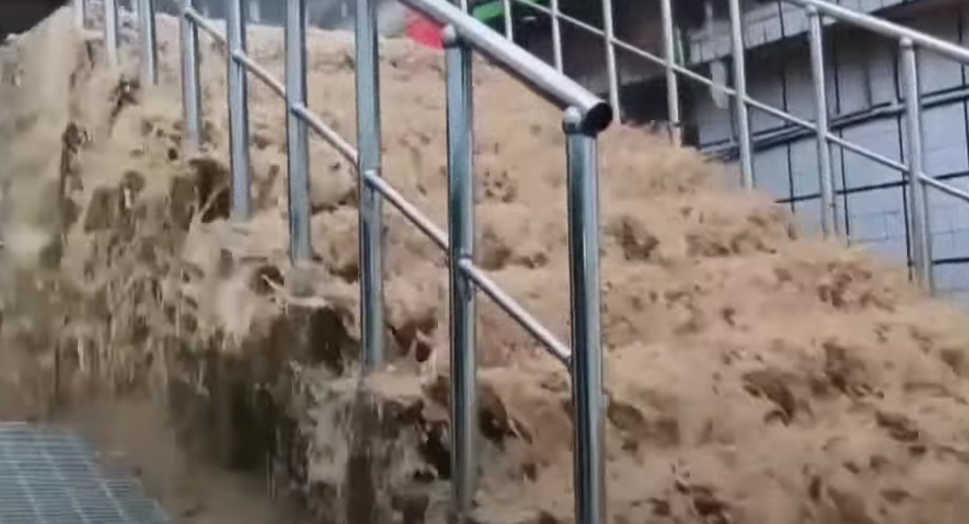 flood waters rushing through stairs