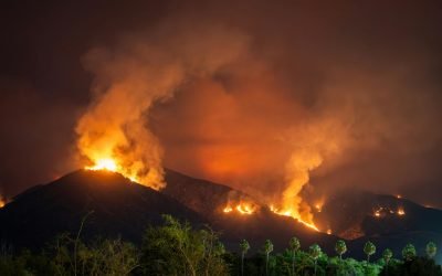 Wildfire Escalates In California While Heavy Rains Put Los Angeles At Risk Of Flooding